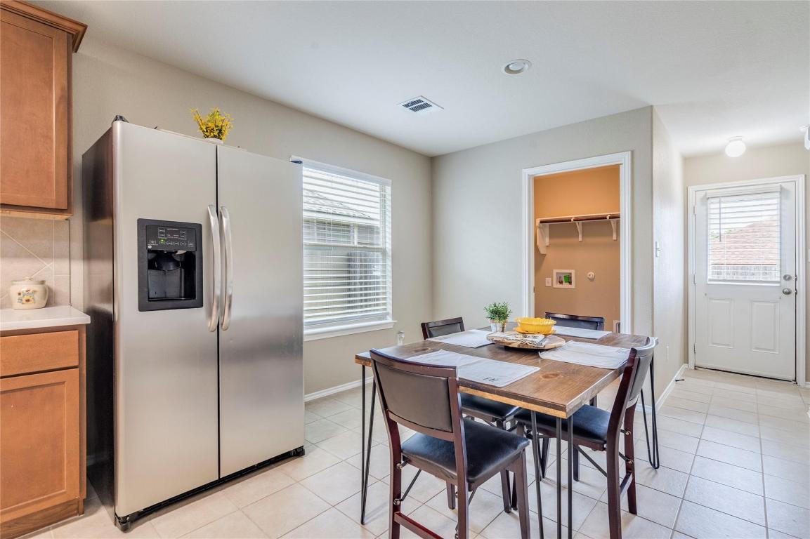 185 Housefinch Loop Leander, TX 78641 - Photo 13 of 39 a dining room with furniture and window