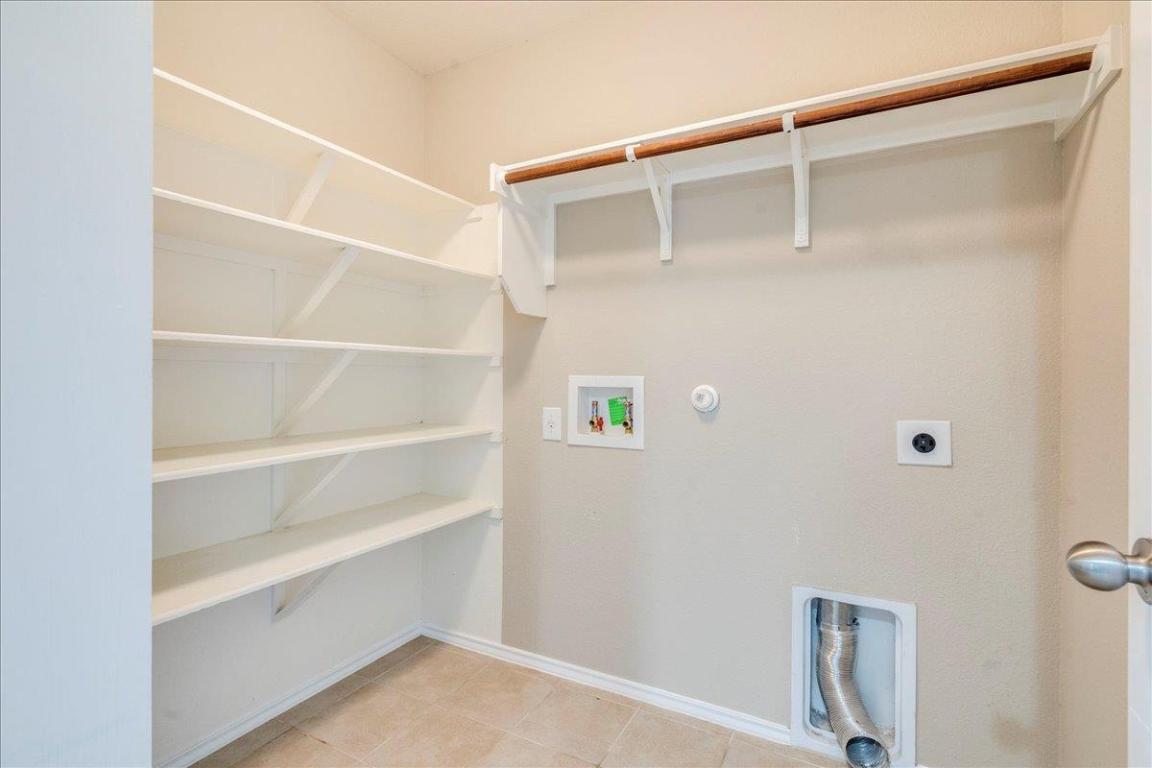185 Housefinch Loop Leander, TX 78641 - Photo 14 of 39 a view of an empty walk in closet