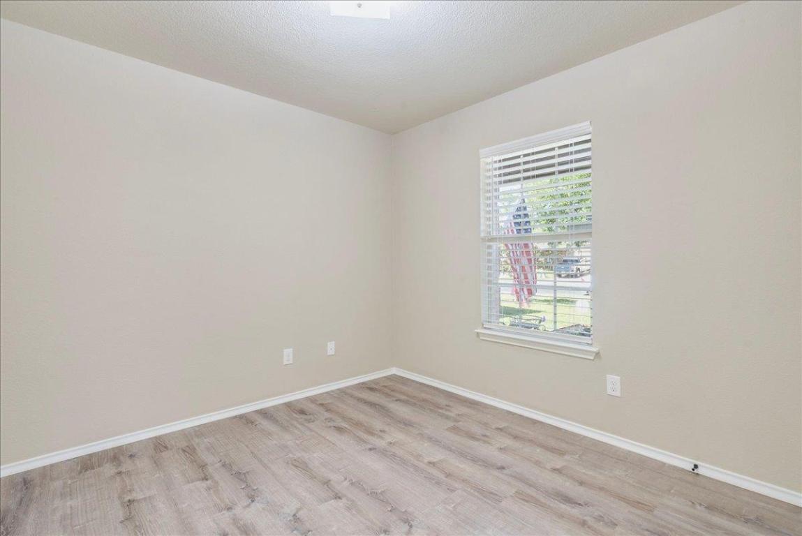 185 Housefinch Loop Leander, TX 78641 - Photo 22 of 39 an empty room with a window