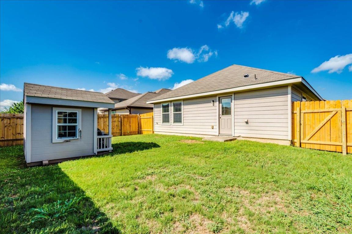 185 Housefinch Loop Leander, TX 78641 - Photo 28 of 39 a view of a house with backyard and garden