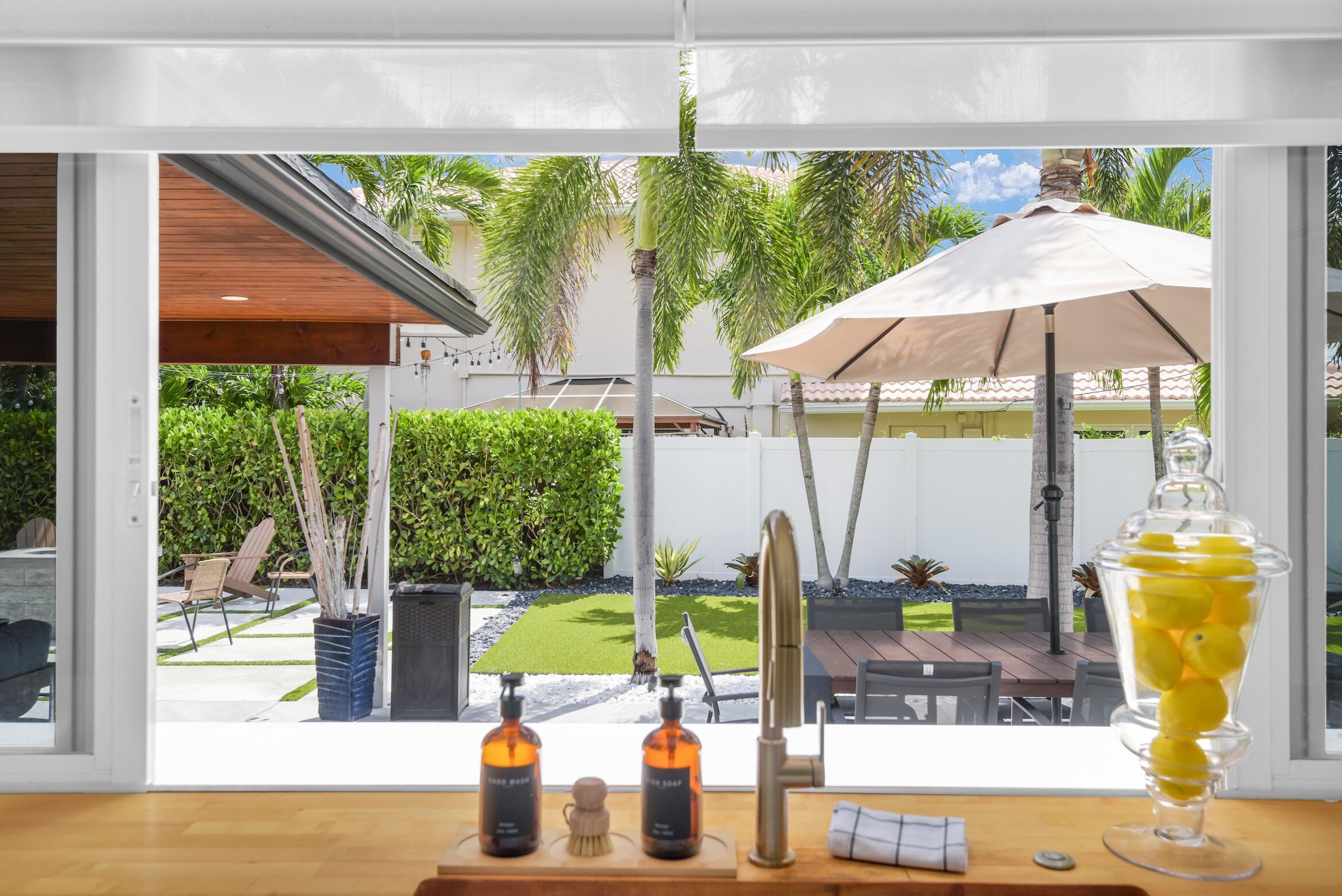 701 Appleby Street Boca Raton, FL 33487 - Photo 10 of 47 a dining room with furniture and a garden view
