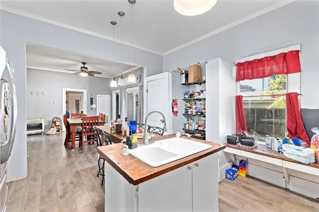 a room with furniture a clock and a view of living room