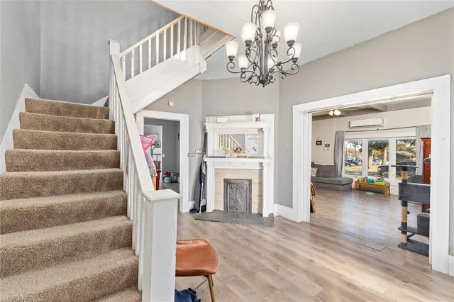 a view of a livingroom with furniture and staircase
