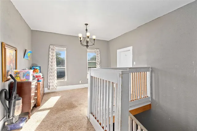 a view of a livingroom with furniture and windows