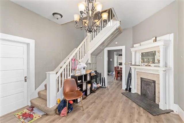 a view of a livingroom with furniture and a fireplace