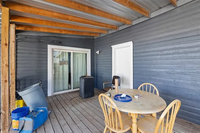 a table and chairs in front of a house