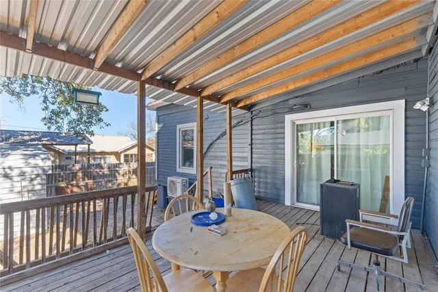 a view of a house with backyard porch and sitting area