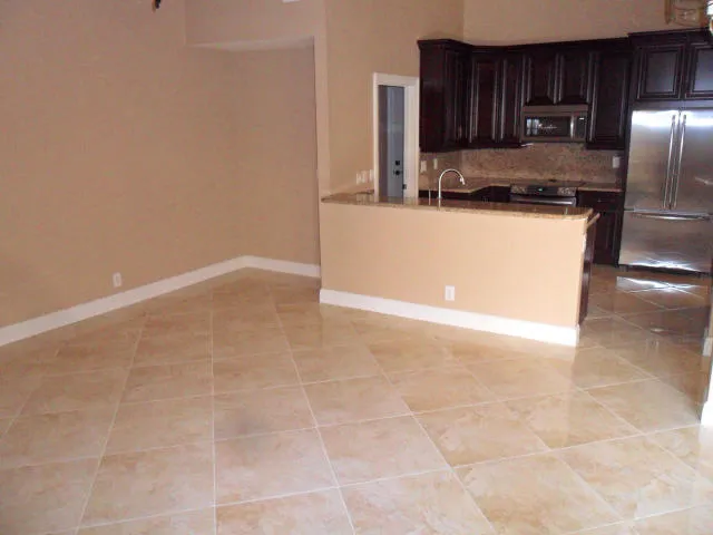 a kitchen with granite countertop a cabinets and steel appliances