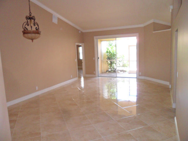 10123 Caoba Street Palm Beach Gardens, FL 33410 - Photo 5 of 16 a view of empty room with window