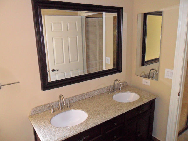 10123 Caoba Street Palm Beach Gardens, FL 33410 - Photo 7 of 16 a bathroom with a sink vanity and a mirror
