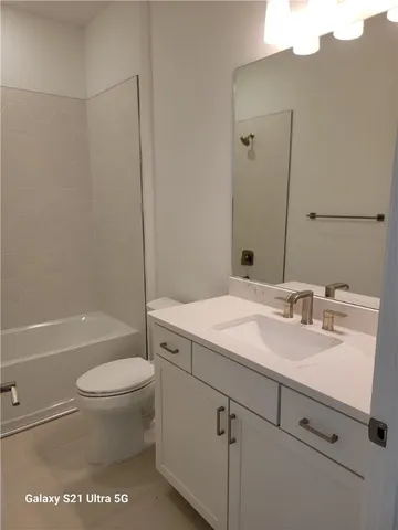 a bathroom with a sink a toilet and a bathtub
