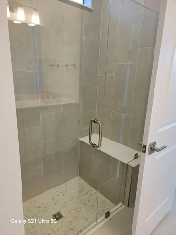 a bath tub sitting next to a shower