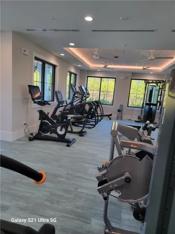 a room with gym equipment and a large window