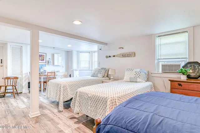 a bedroom with a large bed and window