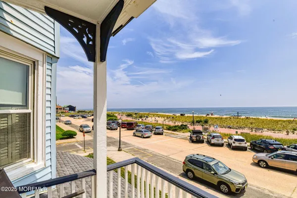 a view of a balcony with an ocean view