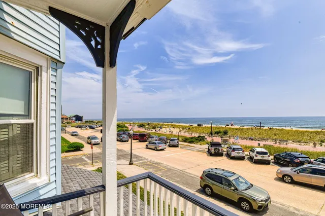 a view of a balcony with an ocean view