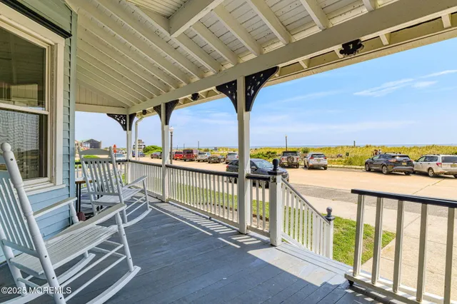 a view of a chairs and table in the balcony