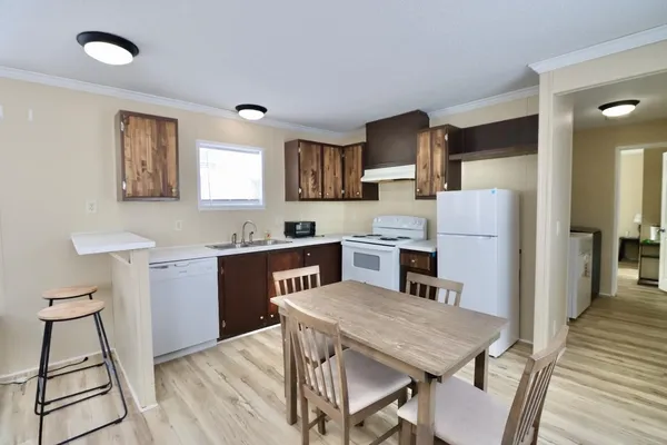 a view of kitchen with cabinets and wooden floor
