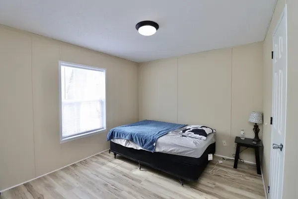 a room with a bed and a window