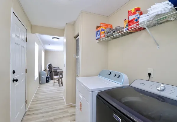 a utility room with dryer and washer