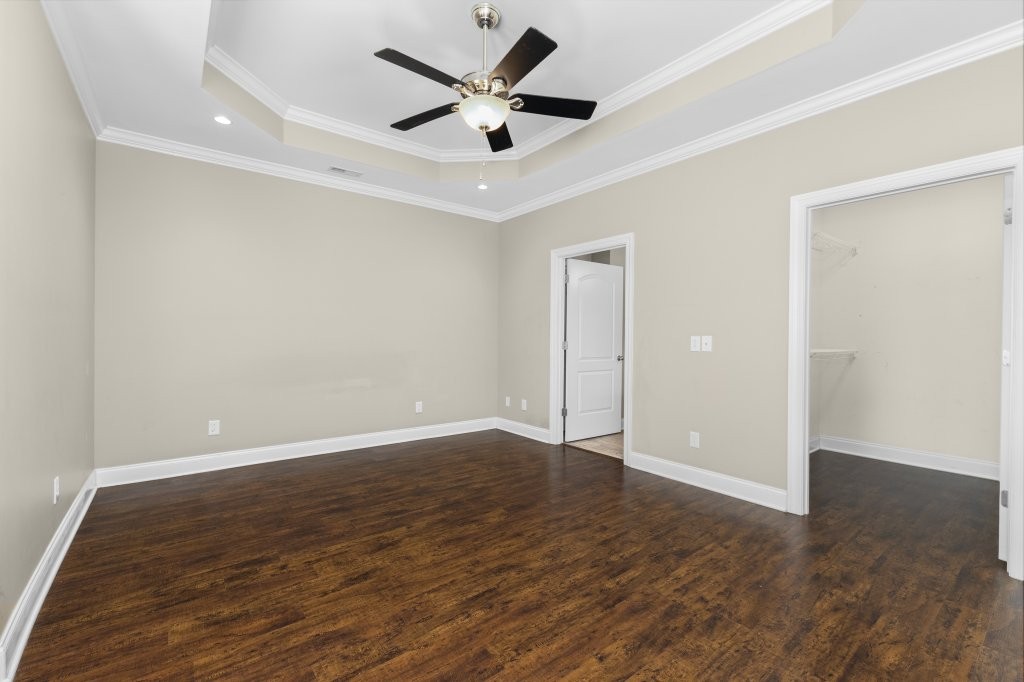 1752 John Lee Lane Murfreesboro, TN 37128 - Photo 18 of 39 an empty room with wooden floor and ceiling fan