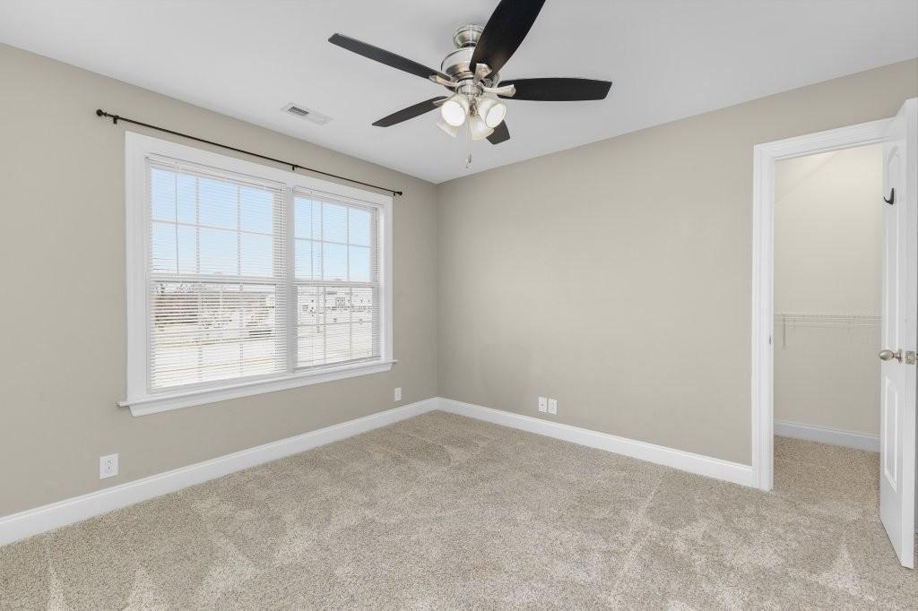 1752 John Lee Lane Murfreesboro, TN 37128 - Photo 30 of 39 an empty room with windows and ceiling fan