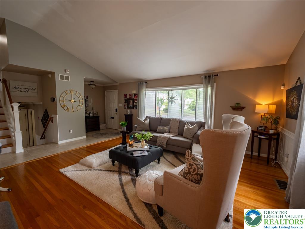 2087 Hopewell Road Bethlehem, PA 18017 - Photo 9 of 38 Hardwood floors and a vaulted ceiling elevate this comfortable living area.
