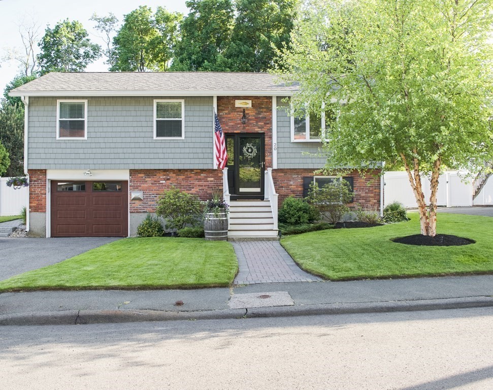 20 Crescent Drive Salem, MA 01970 - Photo 1 of 21 a front view of a house with a yard and a garage