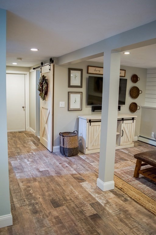20 Crescent Drive Salem, MA 01970 - Photo 13 of 21 a living room with furniture and a flat screen tv