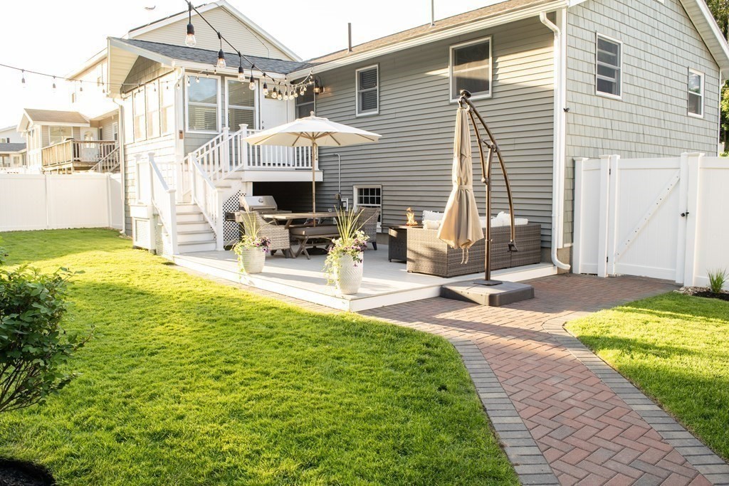20 Crescent Drive Salem, MA 01970 - Photo 20 of 21 a front view of a house with swimming pool and sitting area