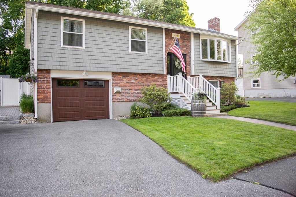 20 Crescent Drive Salem, MA 01970 - Photo 2 of 21 a front view of a house with a yard and garage