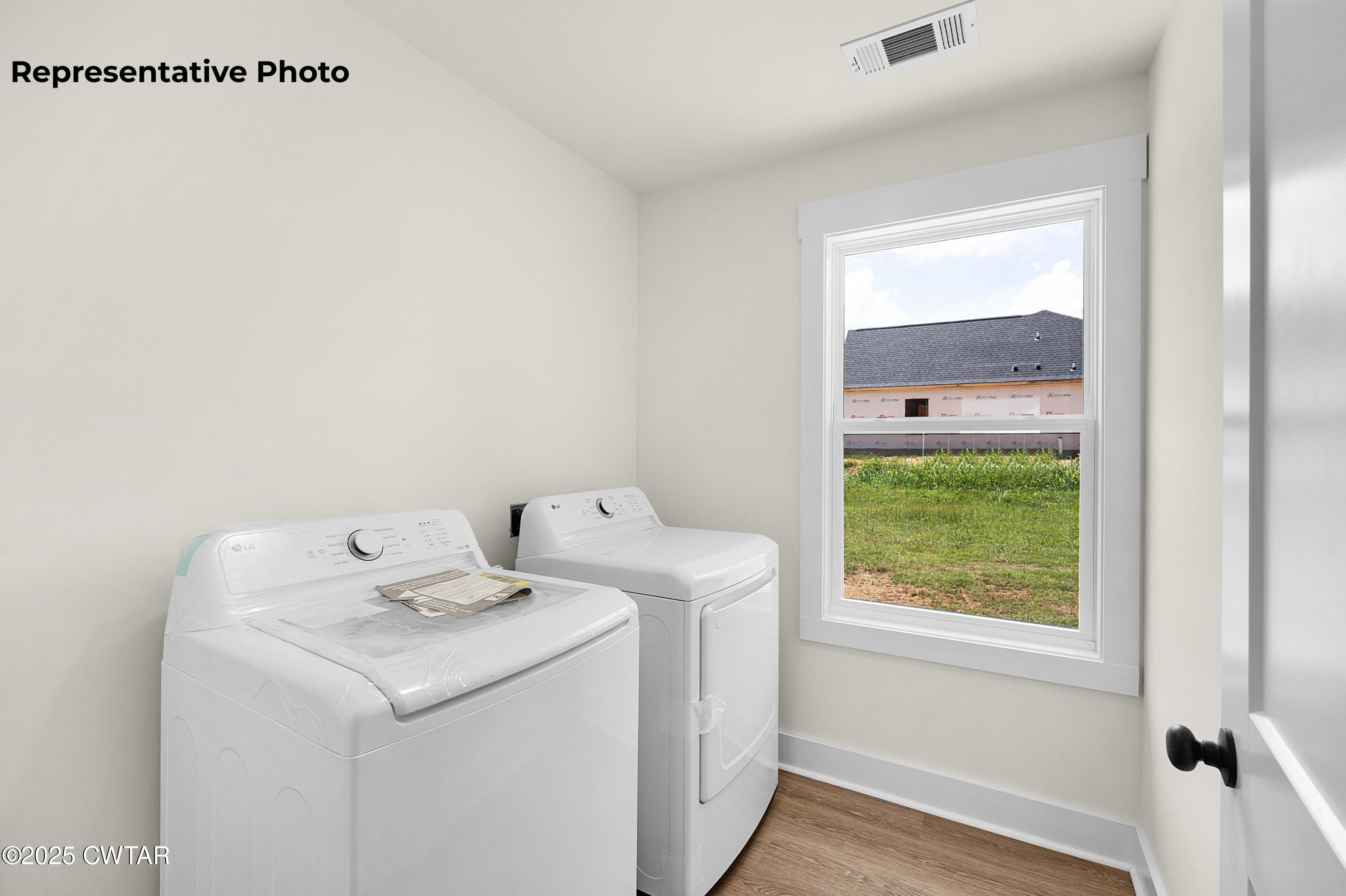 118 Roland Avenue Jackson, TN 38301 - Photo 14 of 24 a utility room with dryer and washer