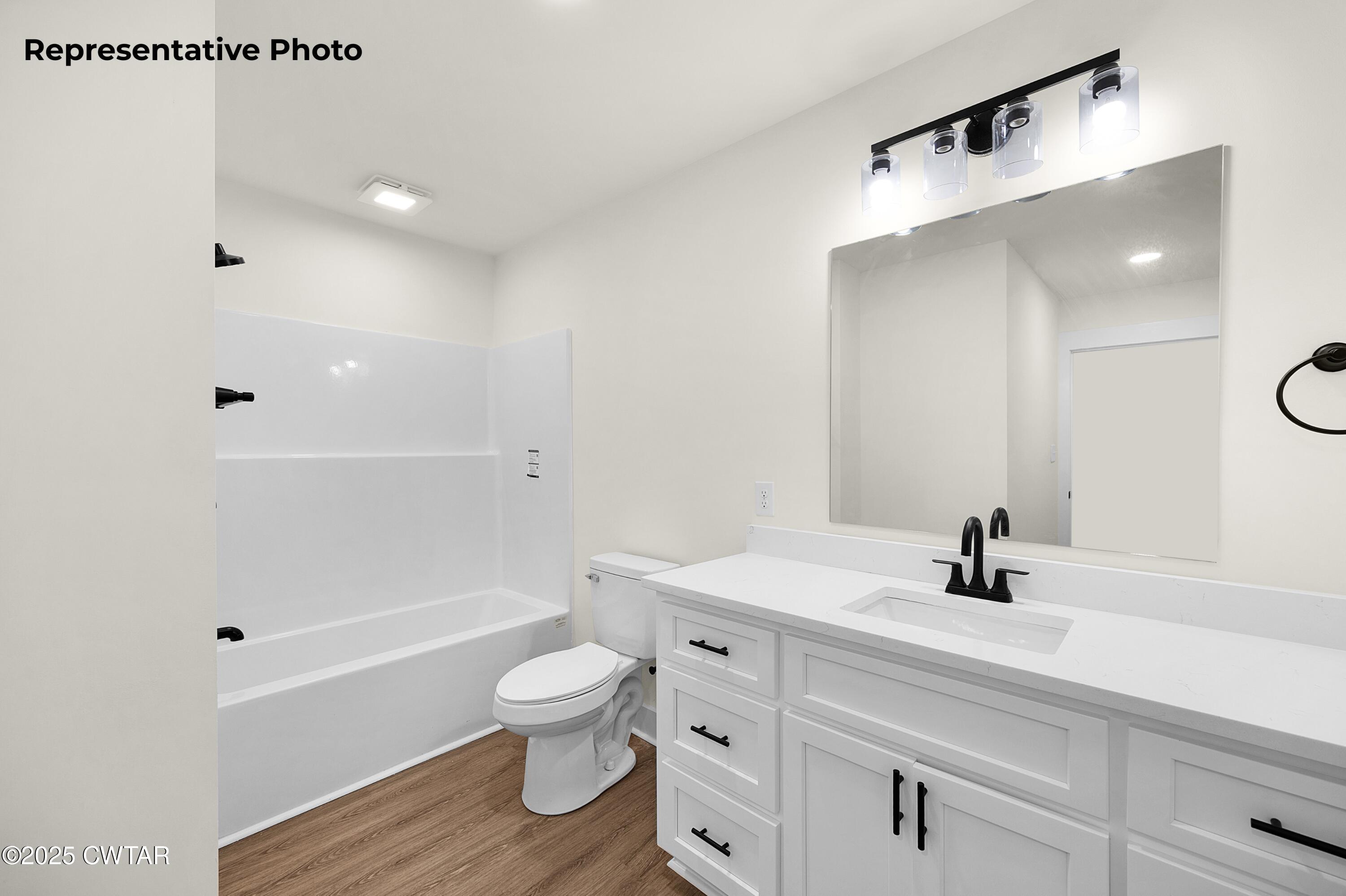 118 Roland Avenue Jackson, TN 38301 - Photo 16 of 24 a bathroom with a sink a toilet and shower