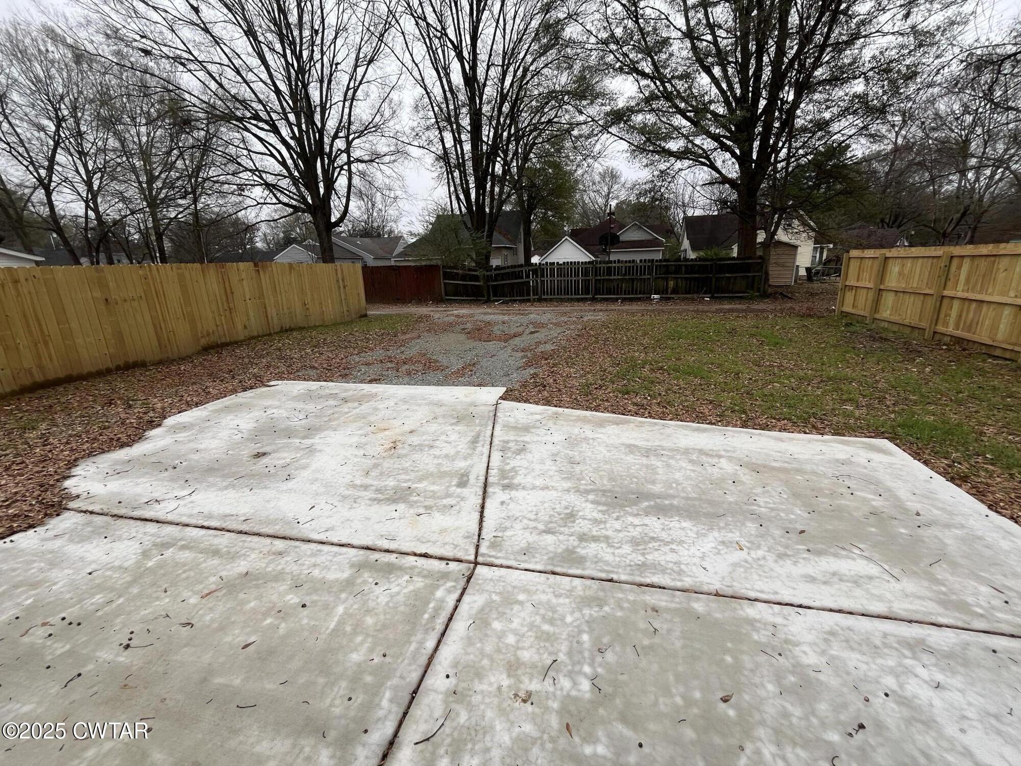 118 Roland Avenue Jackson, TN 38301 - Photo 23 of 24 a view of backyard with wooden fence