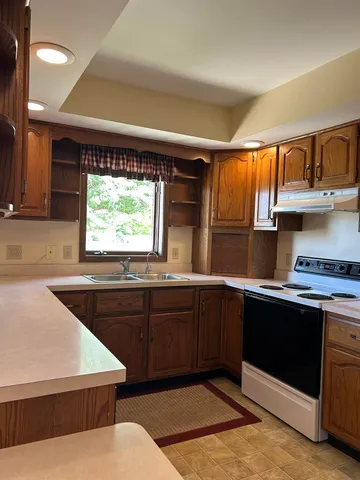 a kitchen with a sink and cabinets