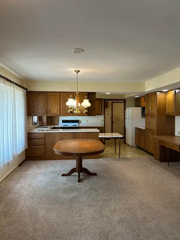 a living room with furniture and a table