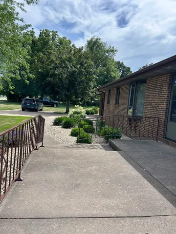 a view of a backyard and pathway