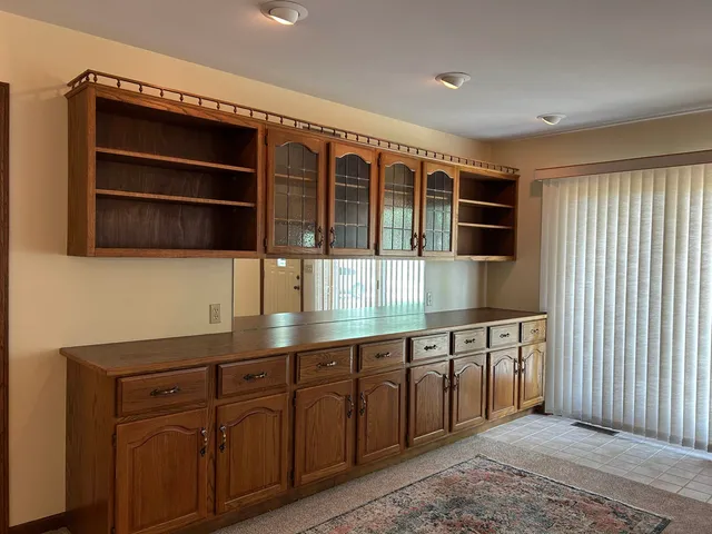 a kitchen with stainless steel appliances granite countertop a sink and a cabinets