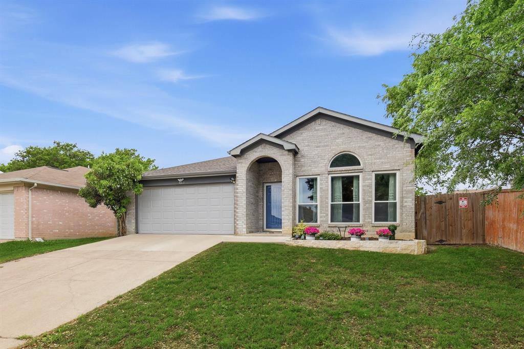 4217 Broken Arrow Road Fort Worth, TX 76137 - Photo 2 of 40 a front view of a house with porch and garden