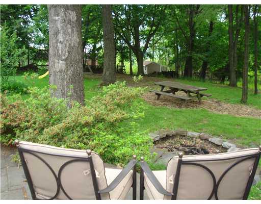 136 Martin Road Pittsburgh, PA 15237 - Photo 5 of 18 Yard/Garden. THE STONE PATIO AND BBQ AREA OVERLOOKS THE PARK-LIKE SETTING WITH FIREPIT.