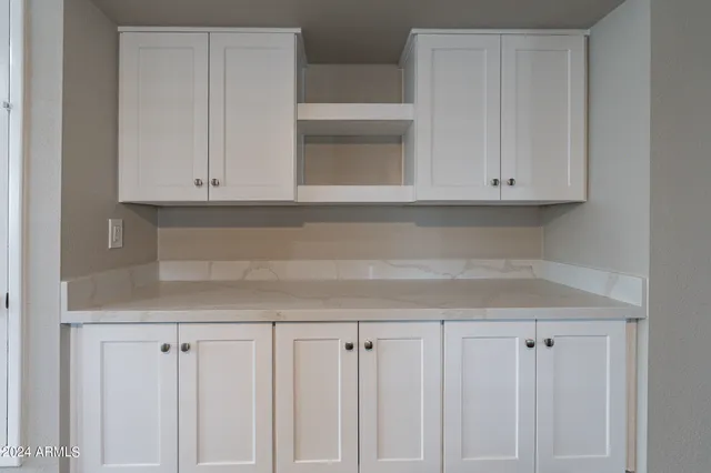 a view of a kitchen with wooden floors