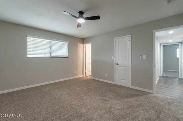 an empty room with closet area