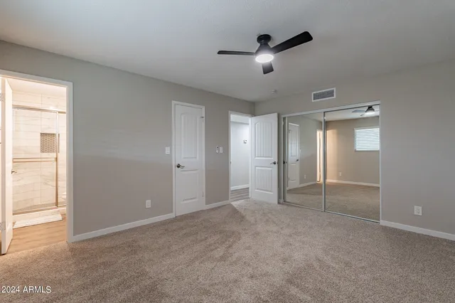 an empty room with a empty space and windows