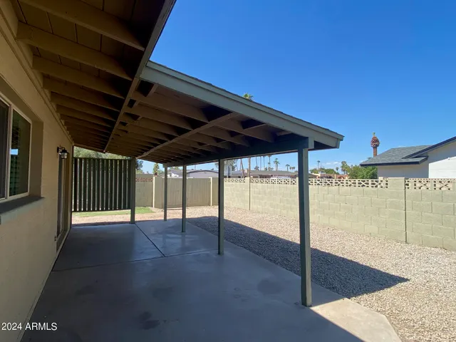 a pathway of a house with a yard