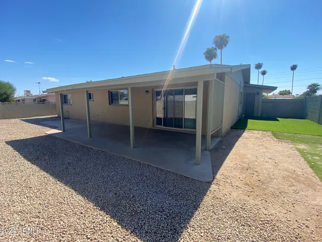 a view of balcony with wooden fence