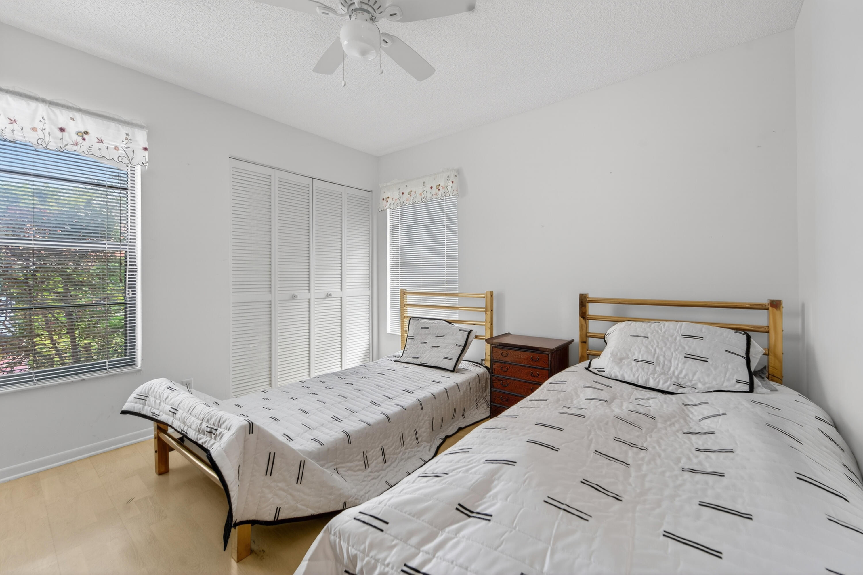 6371 Kings Gate Circle Delray Beach, FL 33484 - Photo 13 of 52 a bedroom with two beds and a window