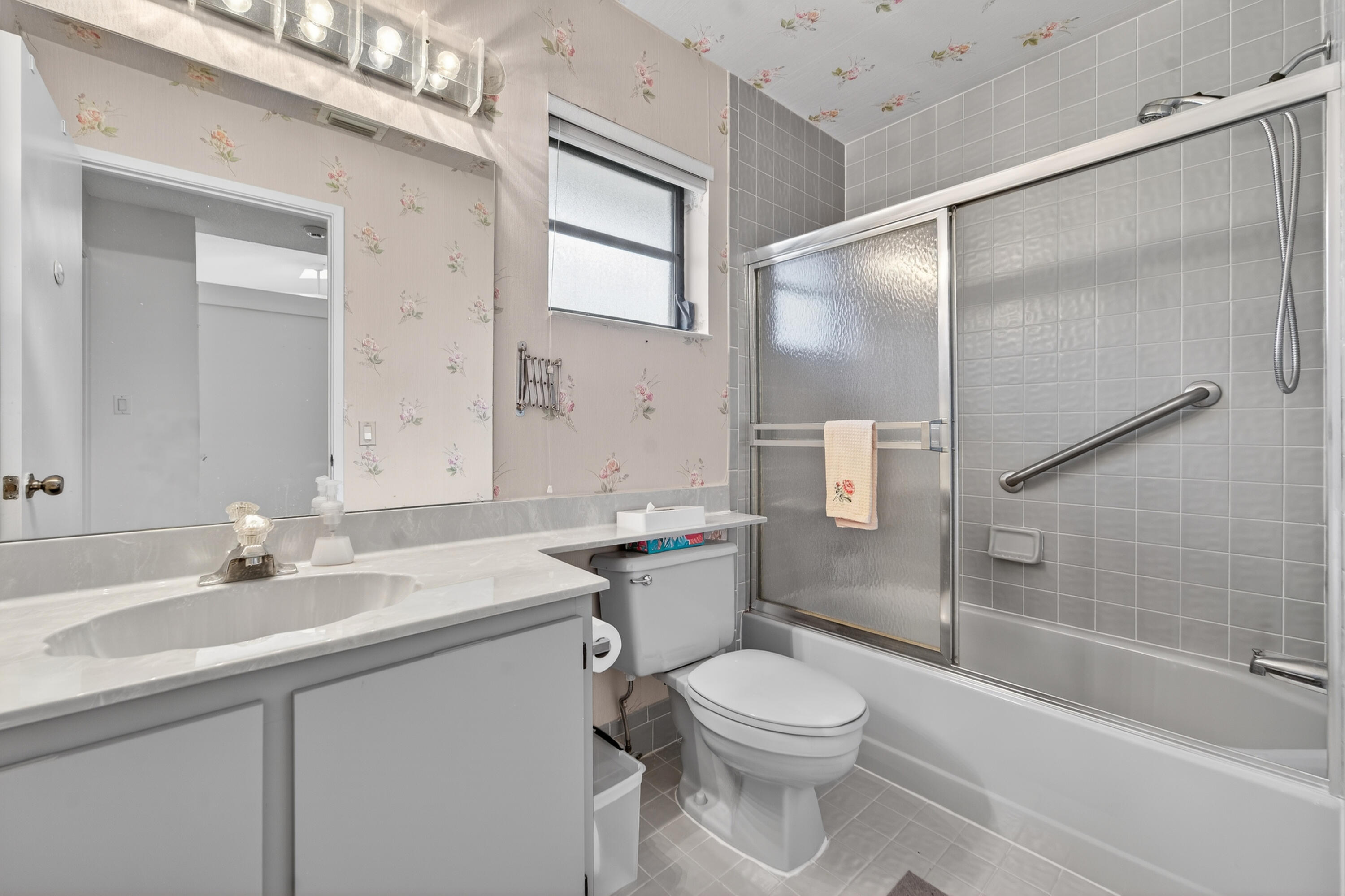 6371 Kings Gate Circle Delray Beach, FL 33484 - Photo 15 of 52 a bathroom with a sink a toilet and shower