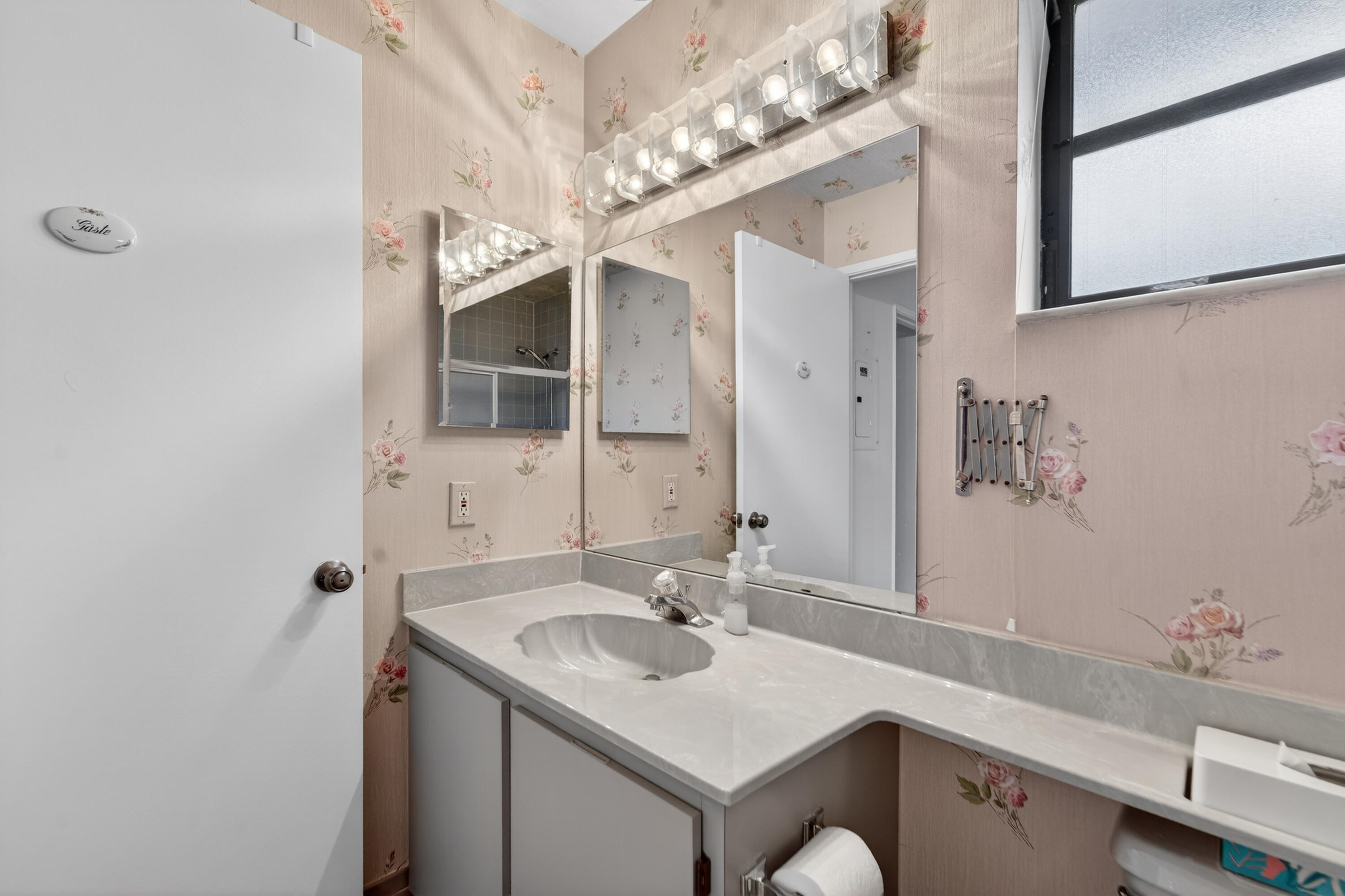 6371 Kings Gate Circle Delray Beach, FL 33484 - Photo 16 of 52 a bathroom with a sink and a mirror