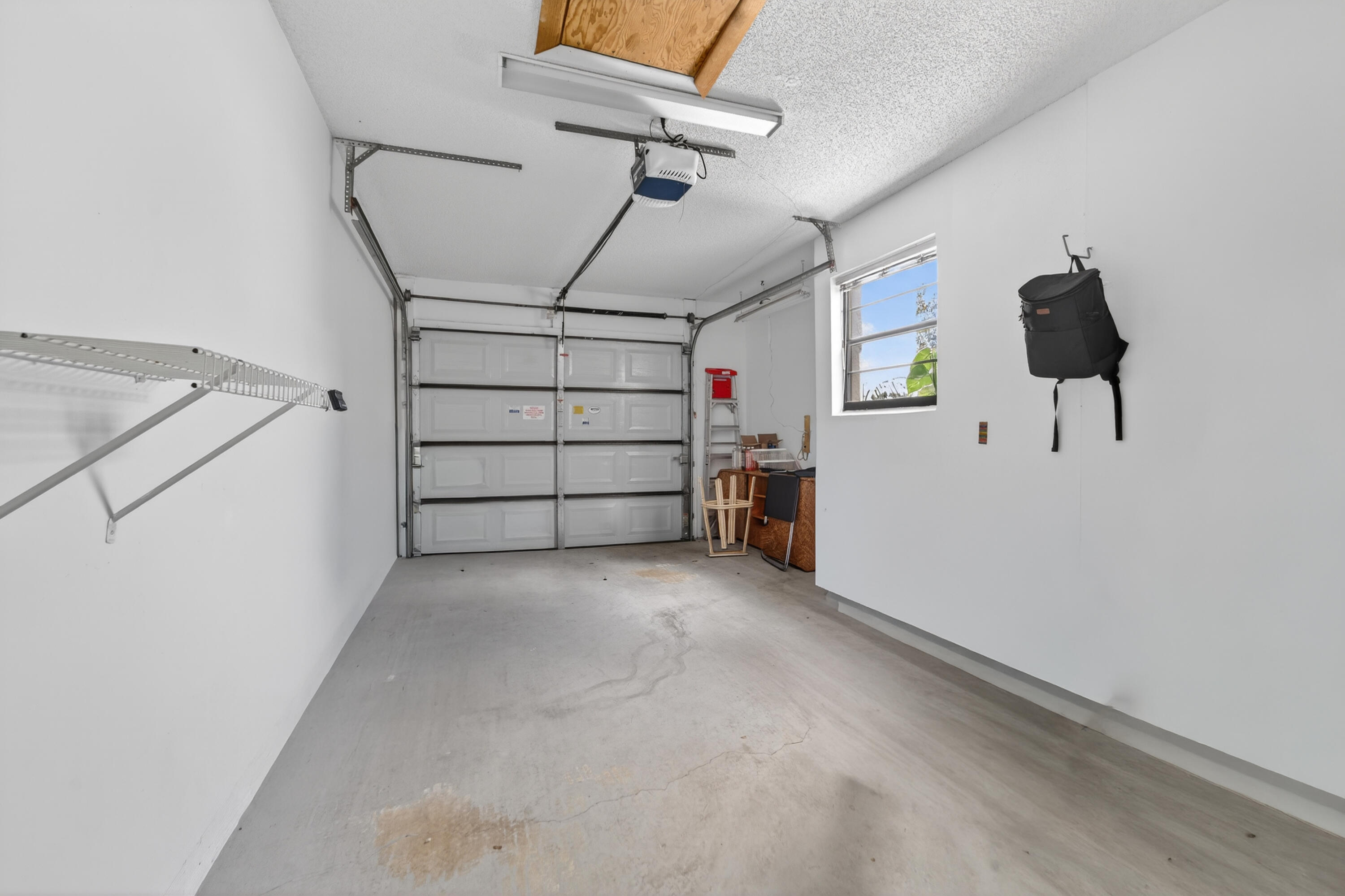 6371 Kings Gate Circle Delray Beach, FL 33484 - Photo 21 of 52 a view of a garage