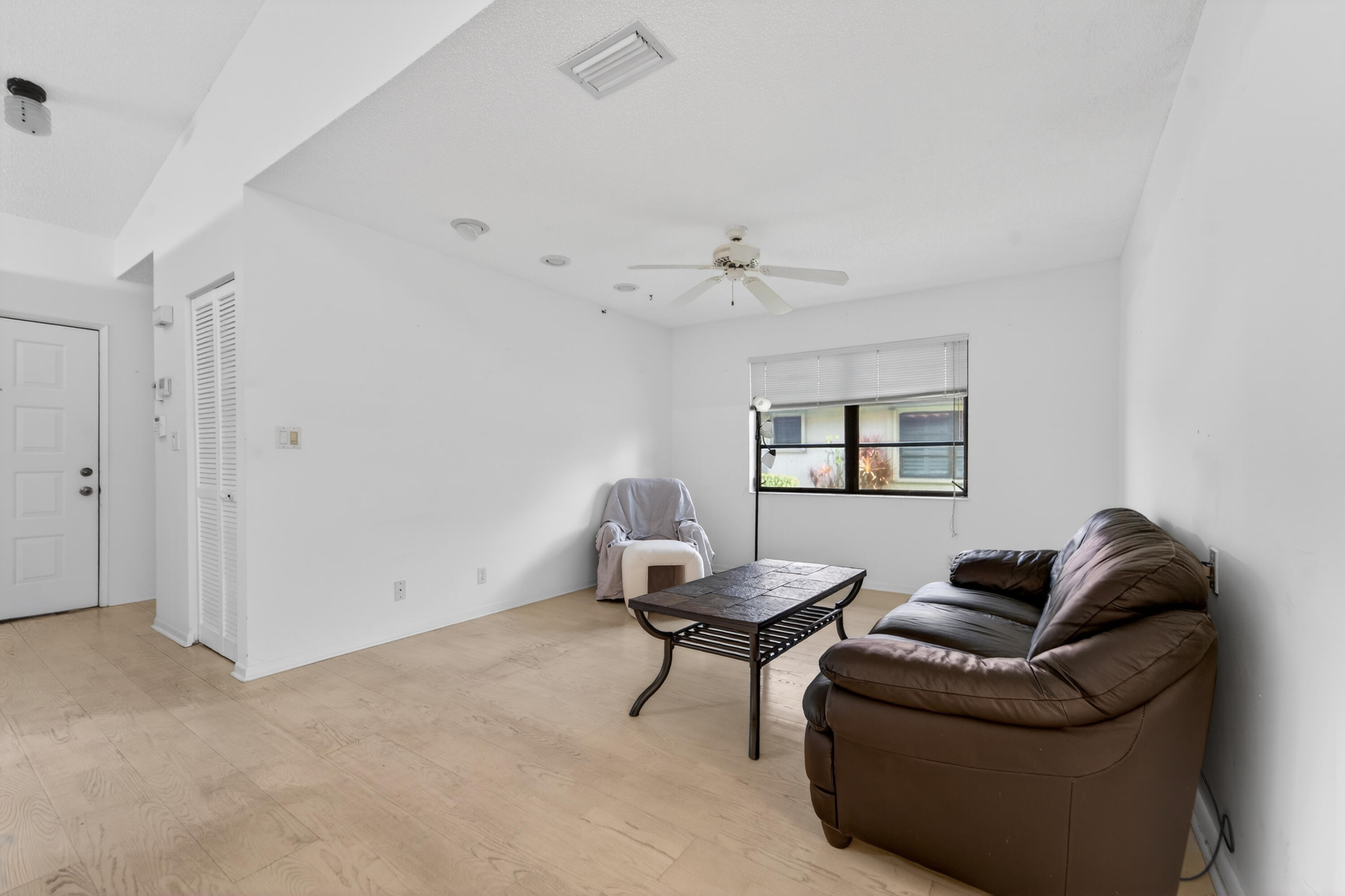 6371 Kings Gate Circle Delray Beach, FL 33484 - Photo 25 of 52 a living room with furniture and a window